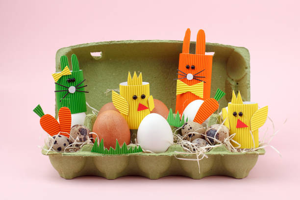 istock Easter holiday concept with eggs, cute handmade bunny, chicks in papaer box for egg, sptingtime background 1131937832