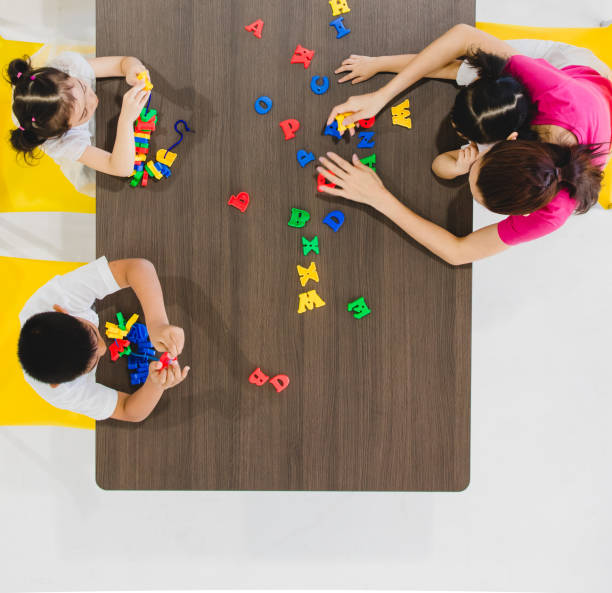 istock Kids playing colorful toys. 1131942909