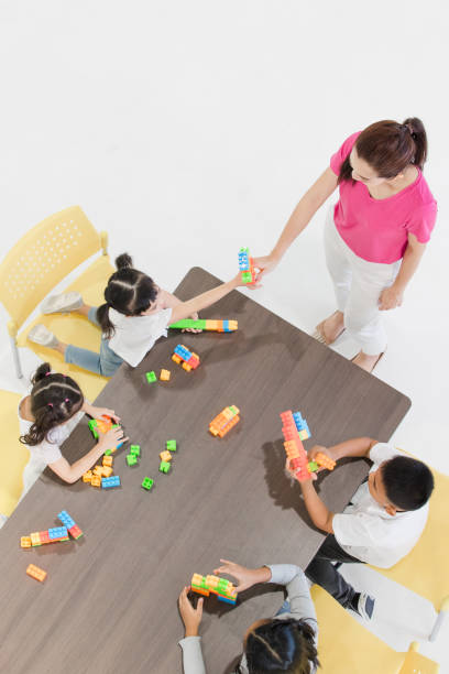 istock Kids playing colorful toys. 1131942940