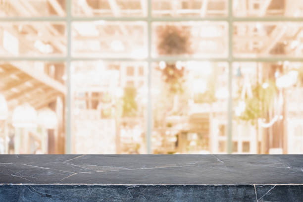 istock Empty background marble stone table top and blurred bokeh cafe and restaurent interior background with vintage filter - can used for display or montage your products. 1131950052