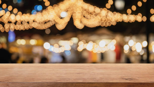 istock Empty wood table top on abstract blurred restaurant and nightclub party lights background - can be used for display or montage your products 1131950071
