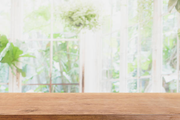 istock Empty wood marble table top and blurred of interior room with window view green from tree garden background background - can used for display or montage your products. 1131950100