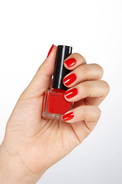 istock hold nail cosmetics with one's. Menicure. 1131950123
