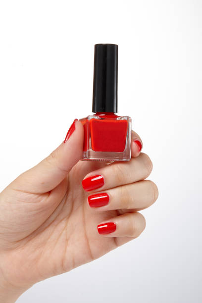Woman polish nails on rubber gloves.