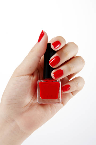 istock hold nail cosmetics with one's. Menicure. 1131950132