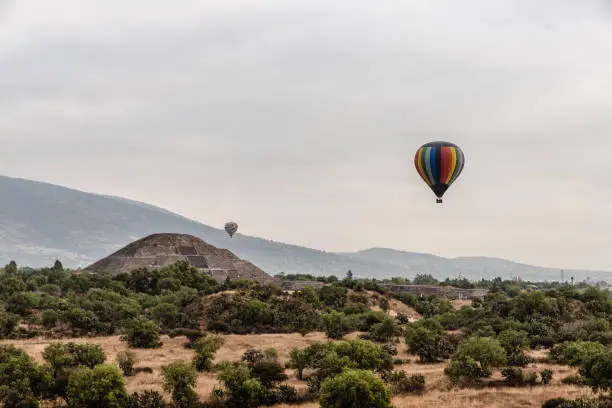 Gorgeous view of Teotihuacan, The SunÂ´s Pyramid surrounded by hot air balloons, shot take at the dawn.