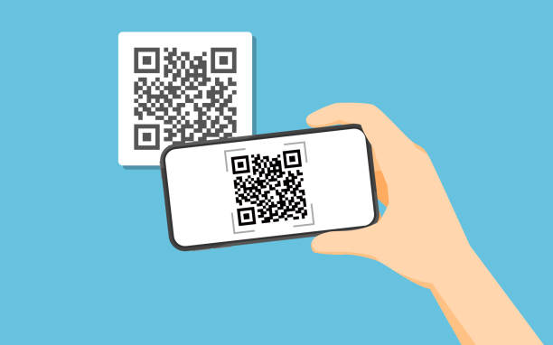 istock Hand holding smartphone to scan QR code on paper for detail 1131959761