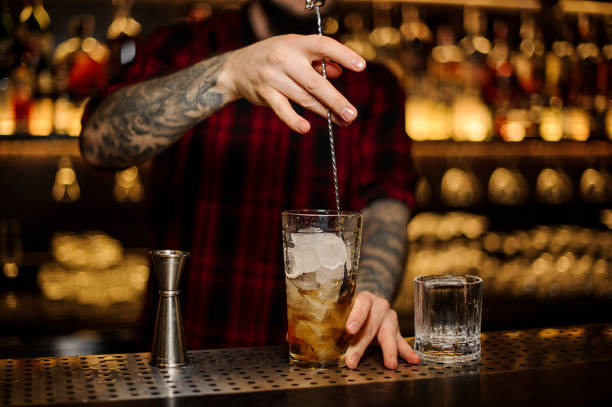 istock Bartender stirring a Rusty Nail cocktail with the spoon 1131960289