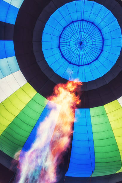istock Hot air balloon with huge flame in foreground 1131960333