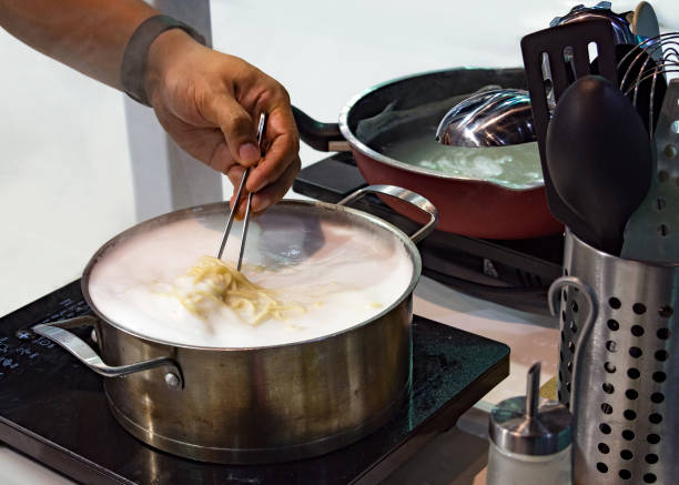 istock Chef preparing food, meal, in the kitchen, chef cooking, Chef decorating dish 1131962157