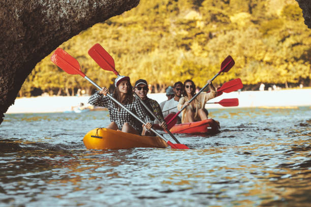 Group friends walk by kayaks kayaking travel stock photo
