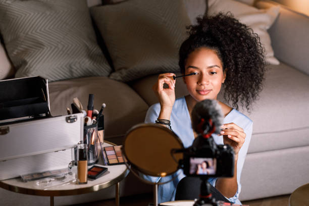 istock Beauty vlogger applying cosmetics on her eye 1131963121