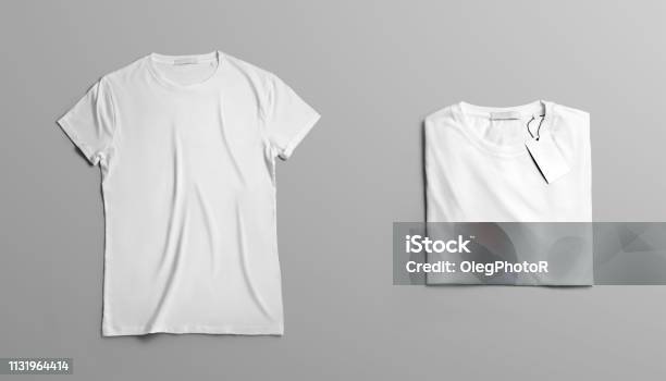 Mockup Of Two Blank Tshirt On A Gray Studio Background Stock Photo - Download Image Now