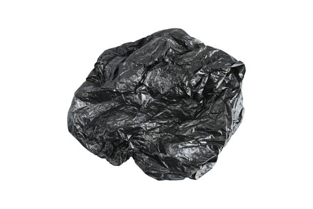 istock Black plastic crumpled bag isolated on white 1131964480