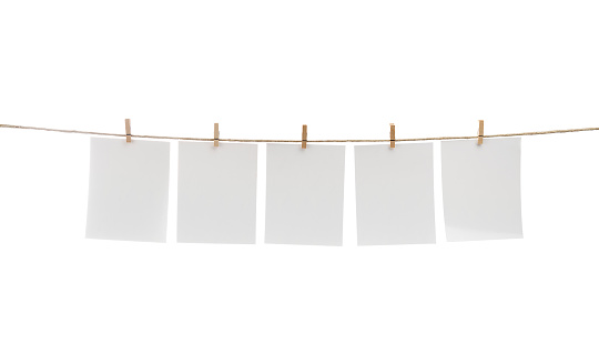 White blank cards with copy space on rope isolated on white background.