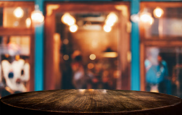 istock Selective Focus Empty wooden table in front of abstract blurred festive background with night market background bokeh for product montage display of product 1131974114