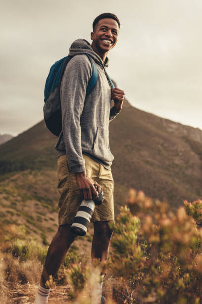 istock Photographer on hike for social media content 1131975628
