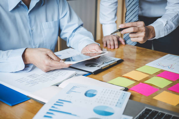 istock Co working conference, Business team meeting present discussing working analysis with financial data and marketing growth report graph in team, Finance, accounting, investment 1131976000