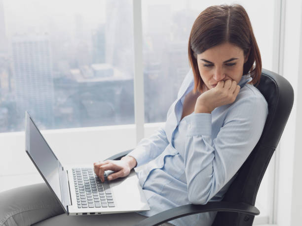 istock Pensive businesswoman working with her laptop 1131976046