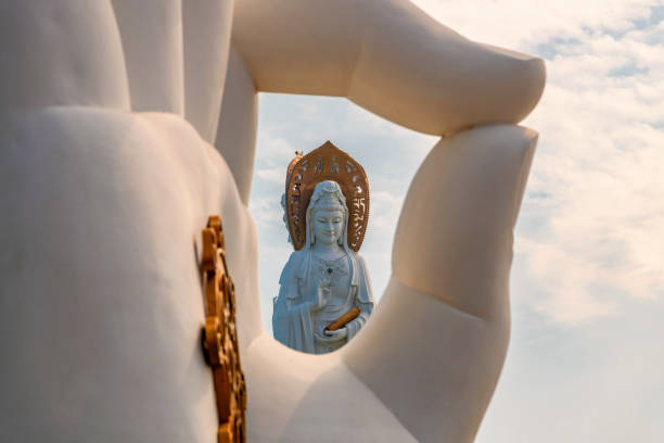 White GuanYin statue in Nanshan Buddhist Cultural Park, Sanya, Hainan Island, China. White GuanYin statue in Nanshan Buddhist Cultural Park, Sanya, Hainan Island, China. kannon bosatsu stock pictures, royalty-free photos & images