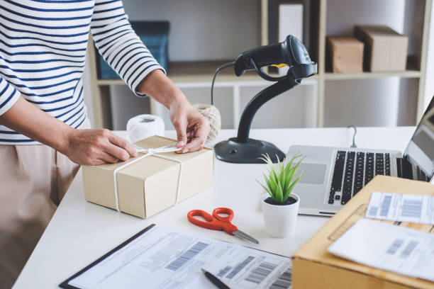 istock Small business owner delivery service and working packing box, business owner working checking order to confirm before sending customer in post office, Shipment Online Sales 1131978225