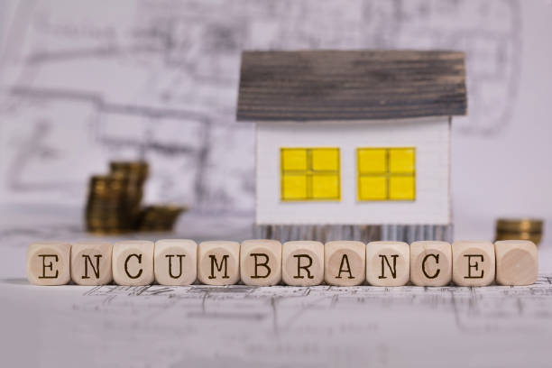 istock Word ENCUMBRANCE composed of wooden letters. 1131981016