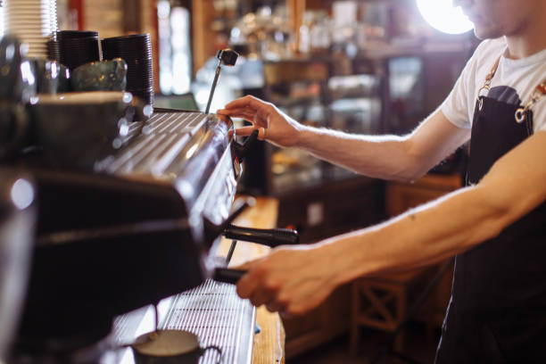 istock coffee to go. man is preparing espressoo 1131981038