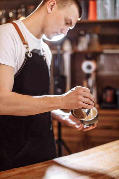 istock a coffeehouse employee is preparing espresso-based coffee drink 1131981068