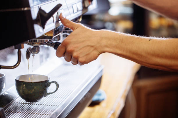 istock man's hands pouring water in the cup 1131981289
