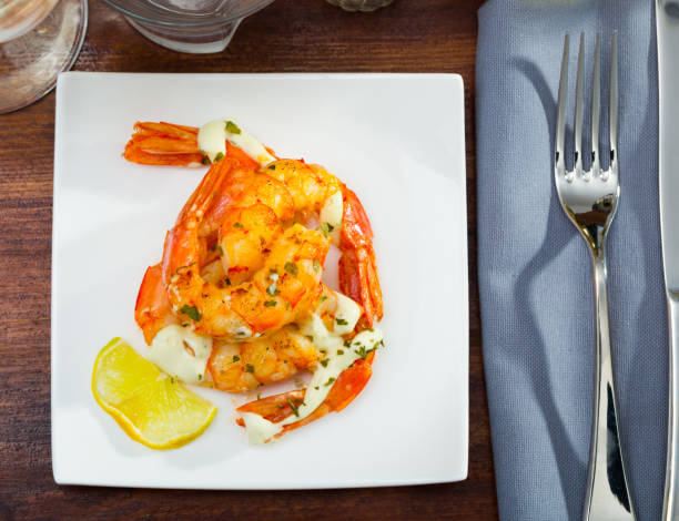 istock Fried shrimps with lemon closeup 1131983027