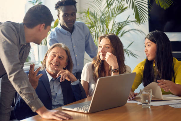 istock Consultations with mentor. Brainstorm in startup company 1131984124