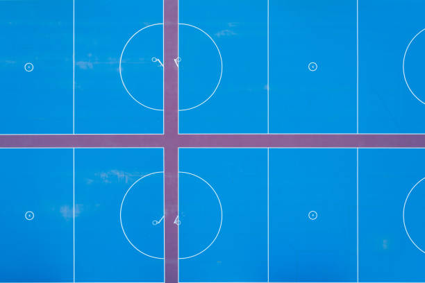 istock Looking down at blue netball courts - aerial view 1131984129