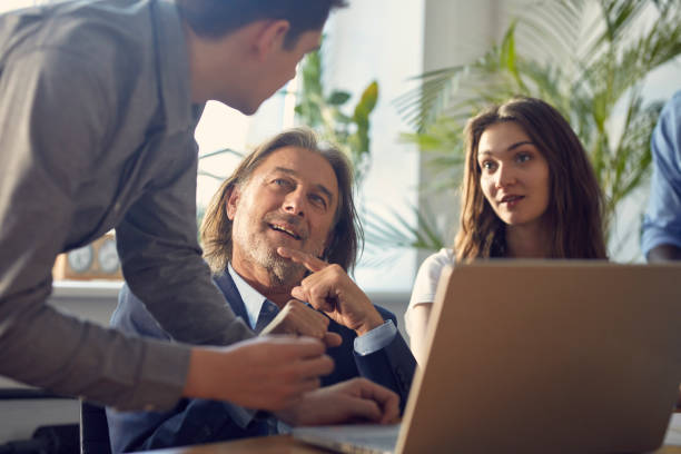 istock Consultations with mentor. Brainstorm in startup company 1131984153