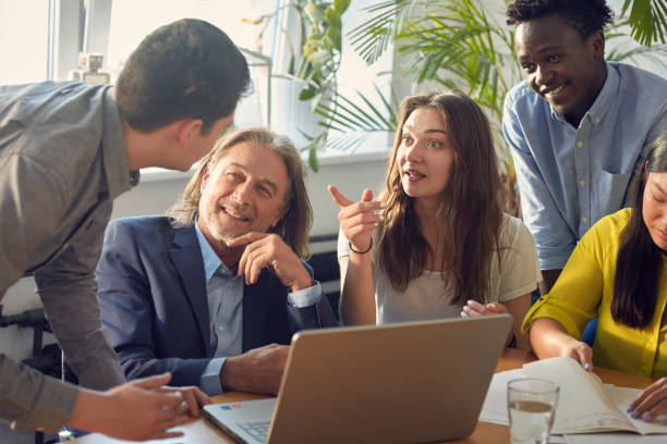 istock Consultations with mentor. Brainstorm in startup company 1131984173