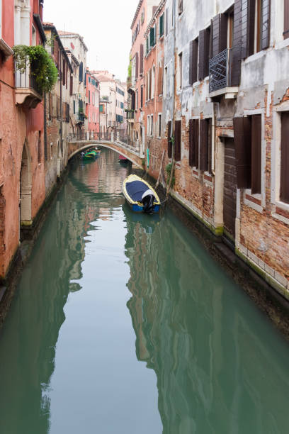 istock narrow venetian canal 1131985749