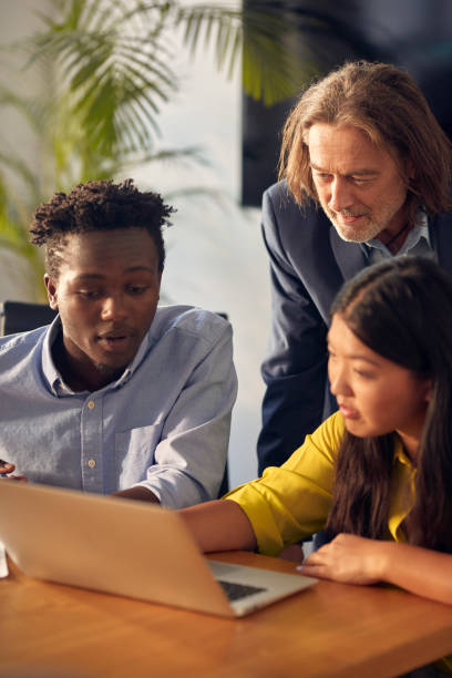 istock Consultations with mentor. Success in startup company 1131986774