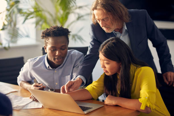 istock Consultations with mentor. Success in startup company 1131986818