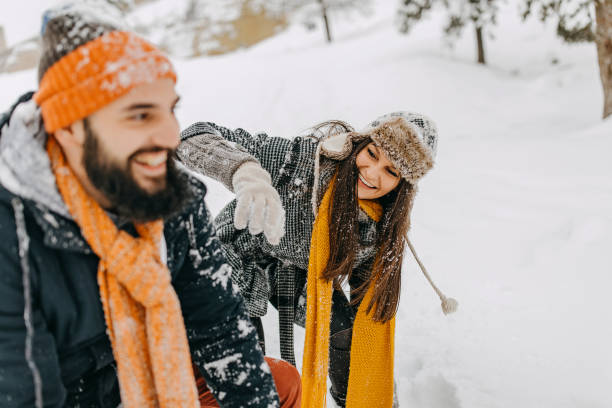 istock Couple in the snow playing 1131987232