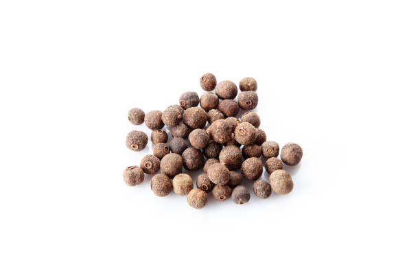 istock Close up view on black pepper isolated on white background. Spices. 1131987558