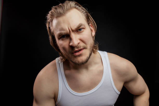 istock Big and strong muscular man laying. Angry fighter having a dust-up. 1131987774