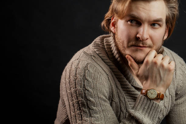 istock close up portrait of blond guy thinking about something 1131988620