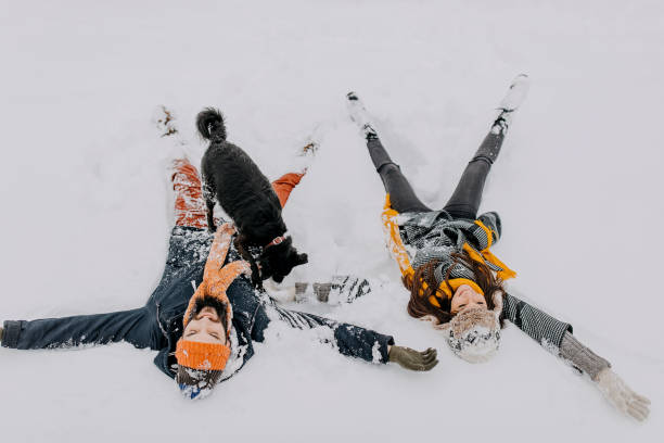 istock Couple in the snow playing 1131988836