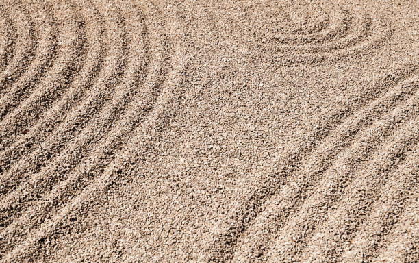 istock Zen patterns on the sand in stone garden 1131989135