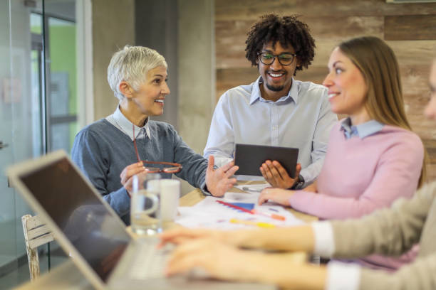 istock Multi-ethnic group of colleagues at meeting 1131989224
