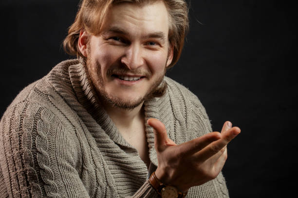 istock close up portrait of young brutal man gesturing while talking 1131991083