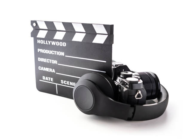 istock Hollywood slate board, headphone and camera on white 1131991095