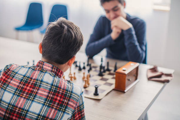 istock Smart boys playing a game of chess 1131991258