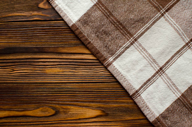 istock brown cloth on vintage wooden table 1131992825
