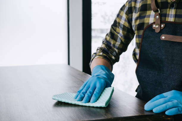 istock Husband housekeeping and cleaning concept, Happy young man wiping dust using a spray and a duster while cleaning on table at home 1131993269