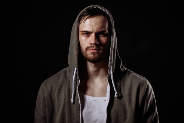 istock horizontal portrait of rapper on the black background. after testing. 1131993285